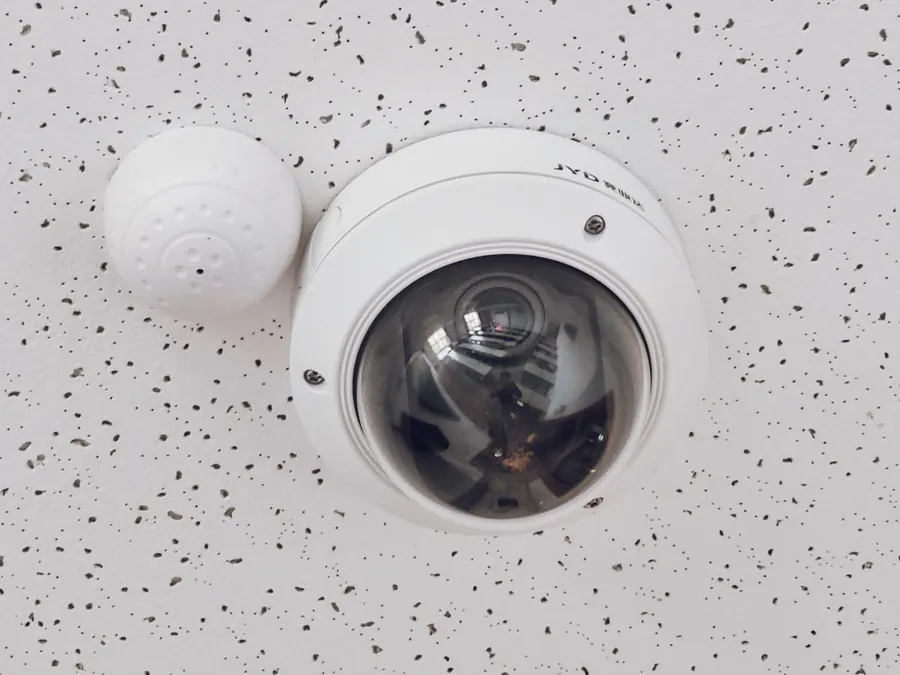 Dome security camera covering a commercial car park