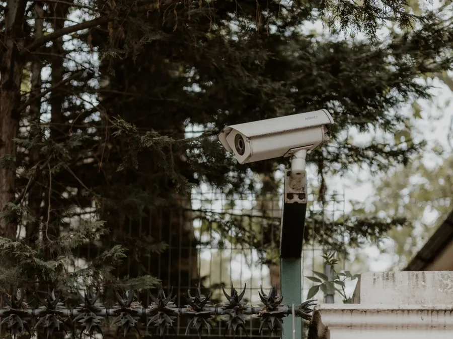 Security camera mounted on the wall of a home
