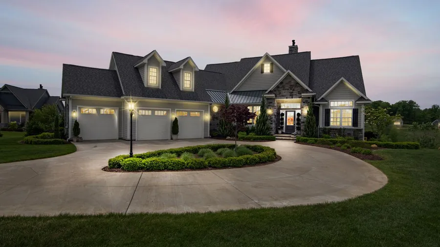 Modern home exterior lit at dusk